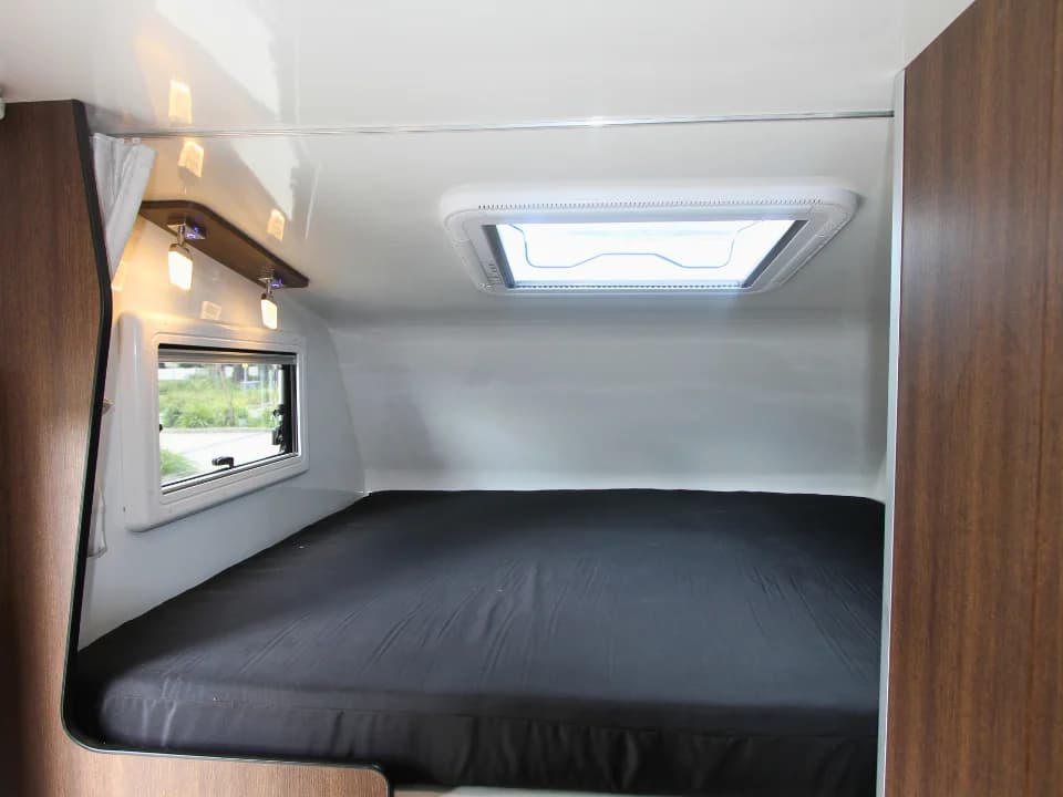 2026 Made by Smidge Long Weekend — rear bed configuration providing additional sleeping capacity for four berths total