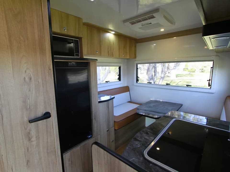 2026 Made by Smidge Long Weekend — interior view looking aft showing the rear bedroom and living zone