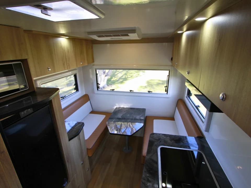 2026 Made by Smidge Long Weekend — interior view looking forward towards the cab, showing the compact living layout