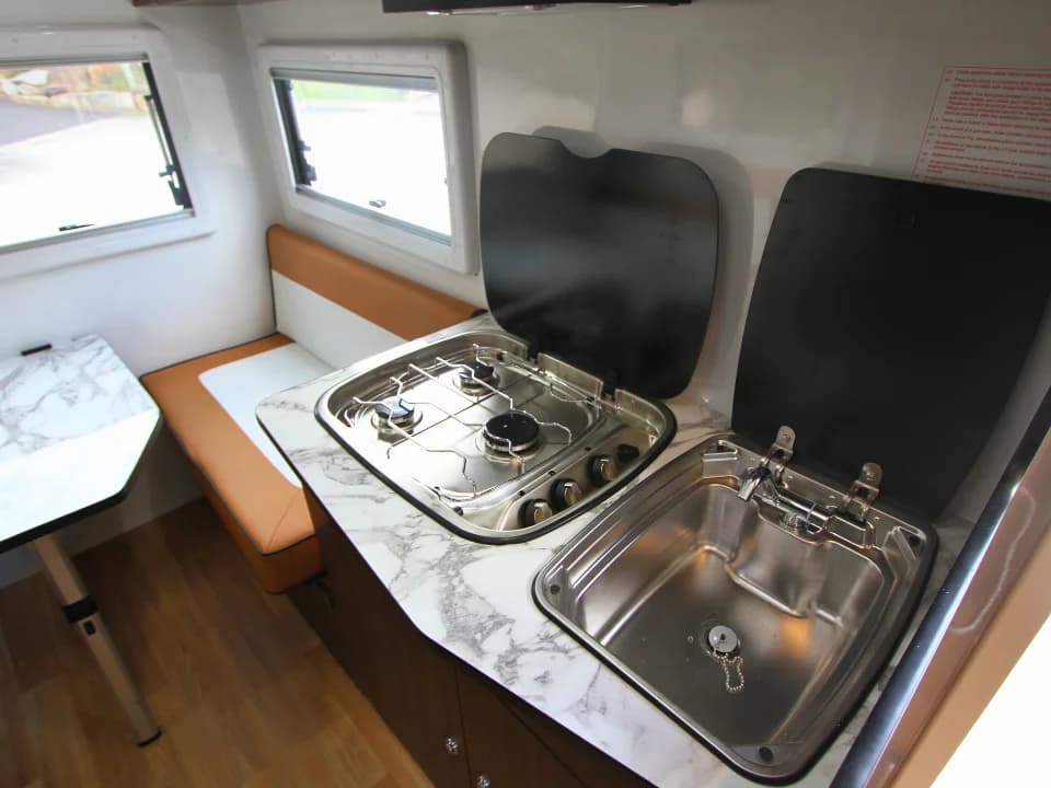 2026 Made by Smidge Long Weekend — kitchen bench and sink area with stainless fittings