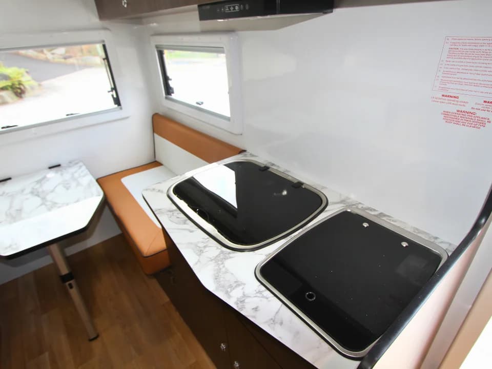 2026 Made by Smidge Long Weekend — kitchen overview showing marine ply cabinetry and compact full-featured layout