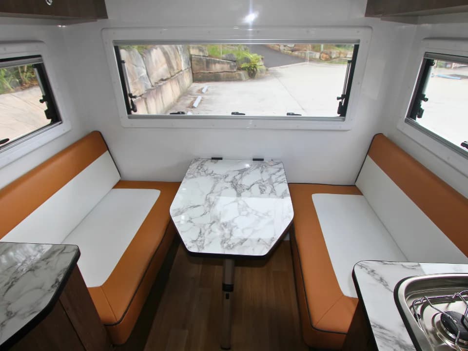 2026 Made by Smidge Long Weekend — dinette seating area that converts to sleeping