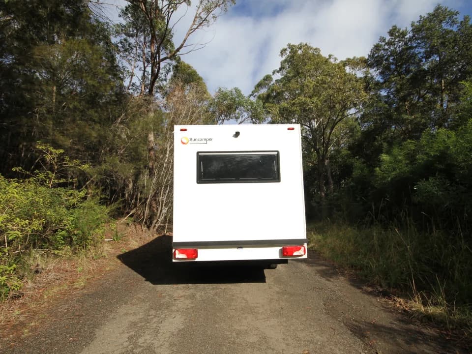Saxby F-2 straight rear exterior with Suncamper logo and panoramic window