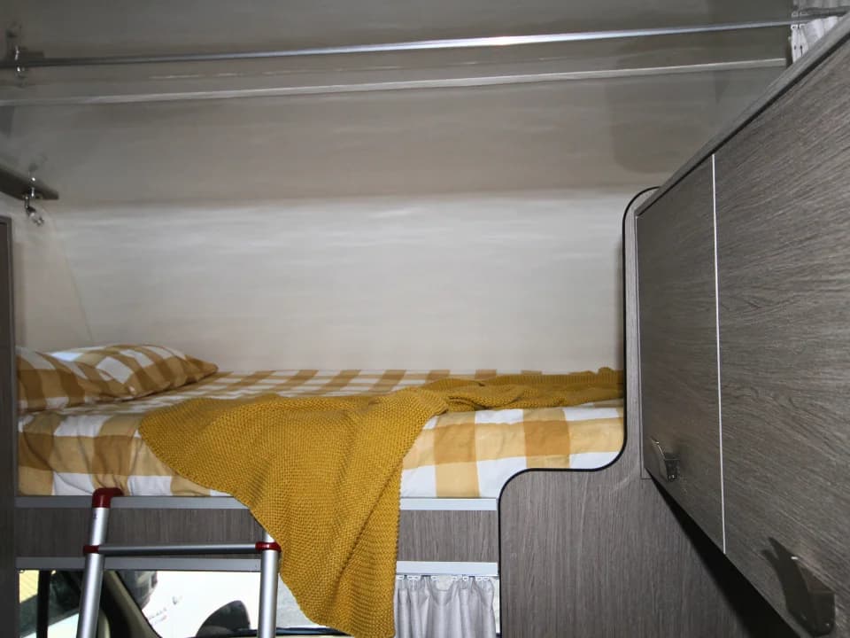 Saxby F-2 interior — nosecone cab bed above the driver area with storage cabinetry