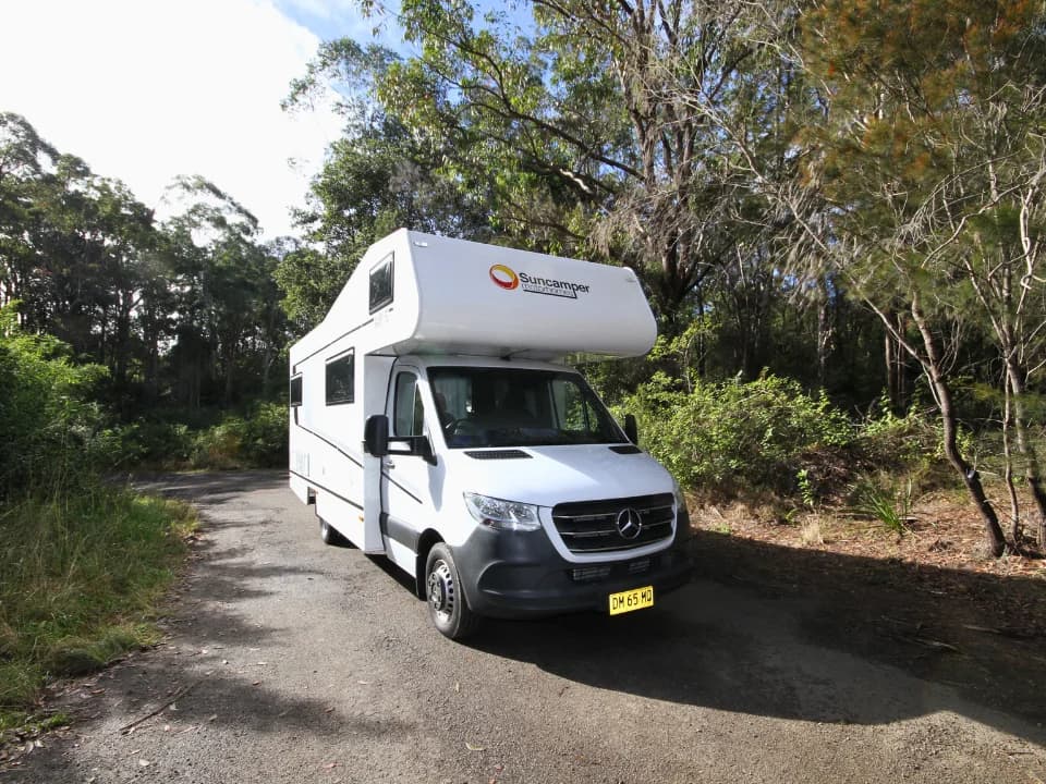 Saxby F-2 demo — front approach exterior with Suncamper Motorhomes nosecone branding