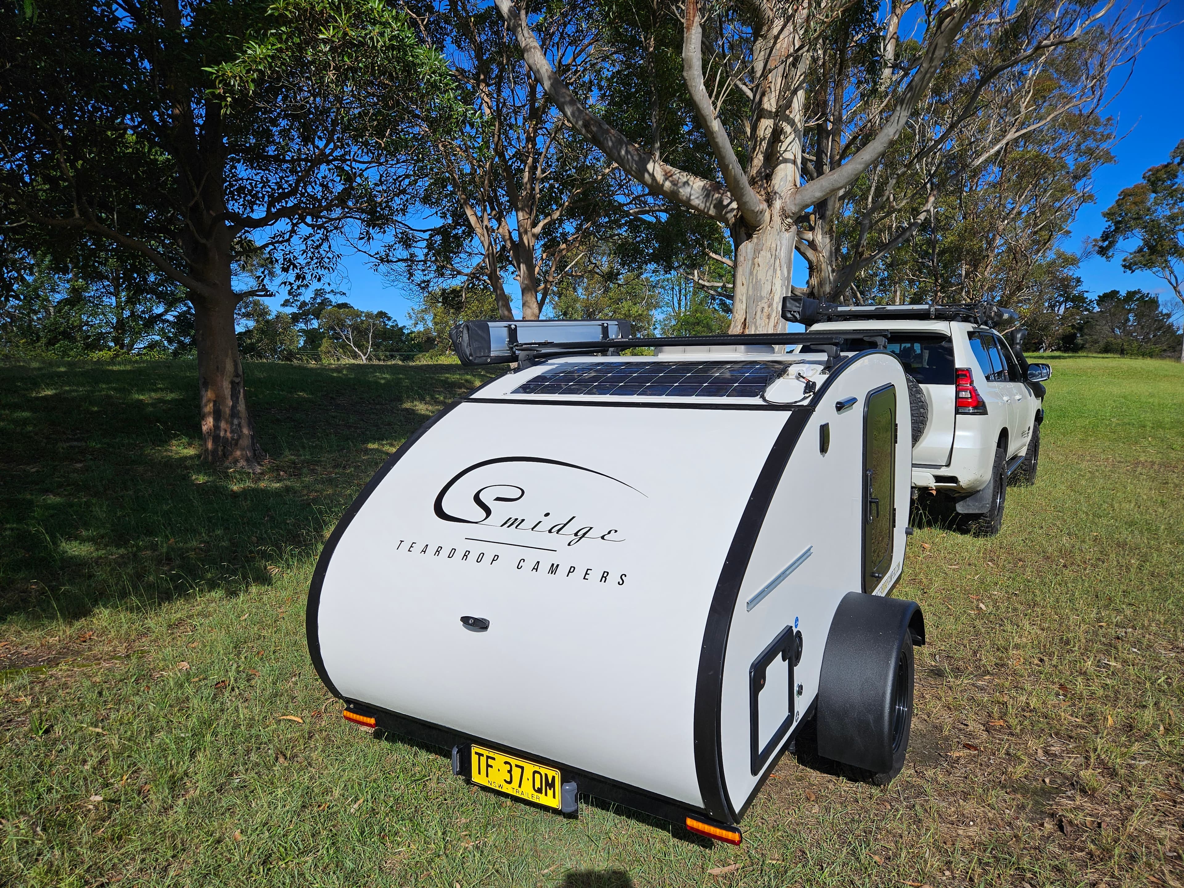 2024 Smidge Breeze teardrop trailer for sale at Northside RV Thornleigh — front view with Smidge logo and solar panel
