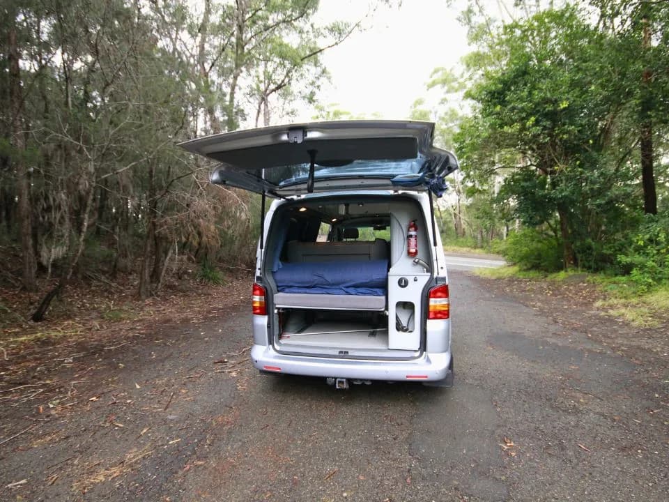 2007 Trakka Trakkadu T5 campervan — rear three-quarter exterior with the tailgate raised