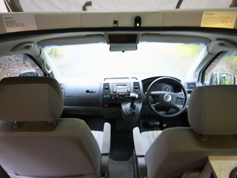 2007 Trakka Trakkadu T5 campervan — front cab with swivel captain's chairs viewed from the living area