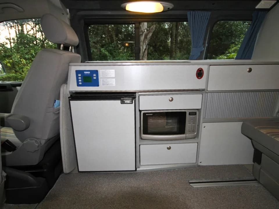 2007 Trakka Trakkadu T5 campervan — interior overview showing the kitchen bench and rear seating