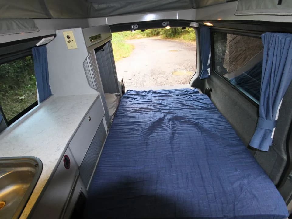 2007 Trakka Trakkadu T5 campervan — rear bench folded flat into a double bed