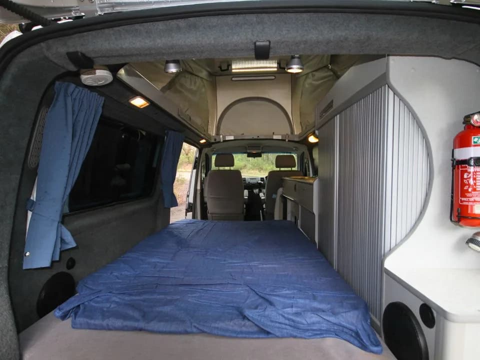 2007 Trakka Trakkadu T5 campervan — double bed made up, wide view from the rear