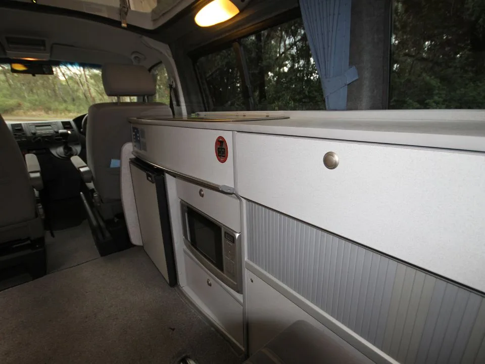 2007 Trakka Trakkadu T5 campervan — interior cabinetry and storage detail