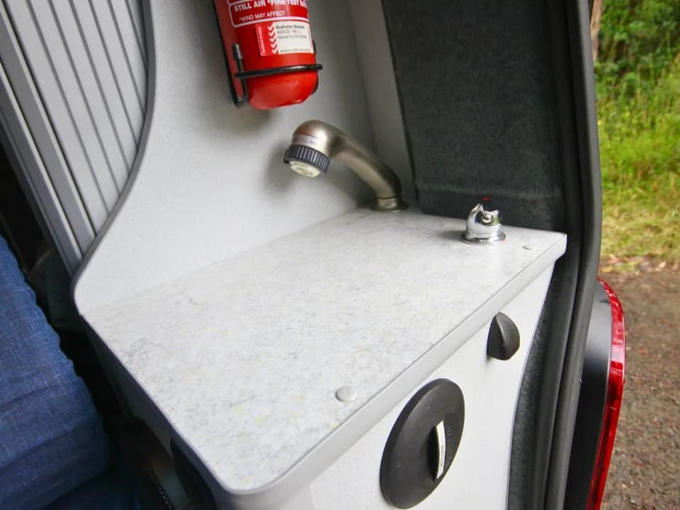 2007 Trakka Trakkadu T5 campervan — rear interior corner with floor storage and tailgate shower point