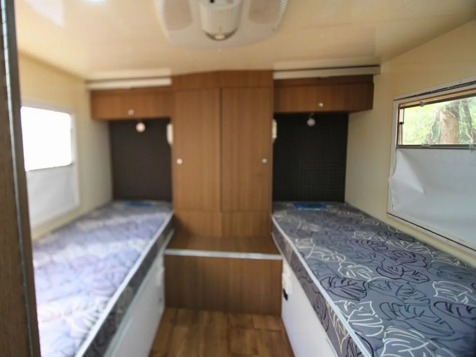 2011 Suncamper Sydney motorhome — interior twin single beds with central wardrobe