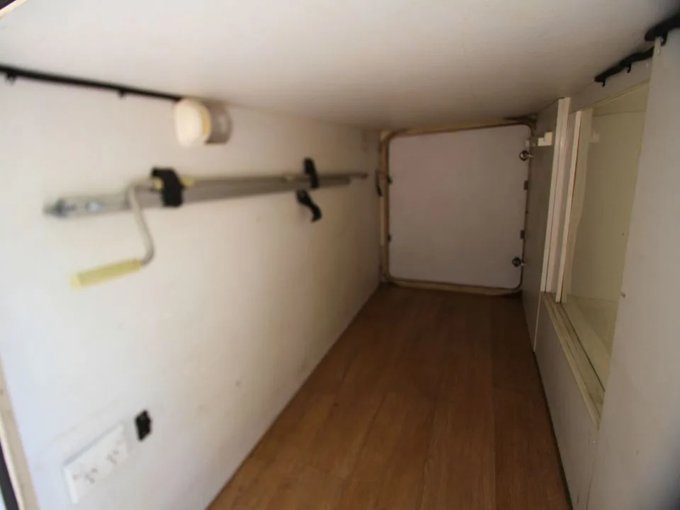 2011 Suncamper Sydney motorhome — interior view of rear garage storage compartment