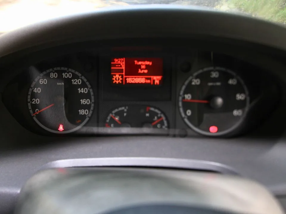 2011 Suncamper Sydney motorhome — instrument cluster showing 153,000 km odometer