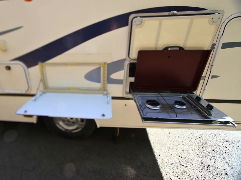 2011 Suncamper Sydney motorhome — outdoor 2-burner gas cooktop detail