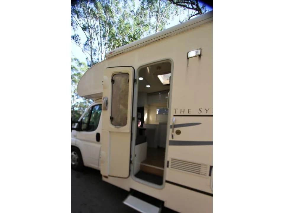 2011 Suncamper Sydney motorhome — passenger side entry door open