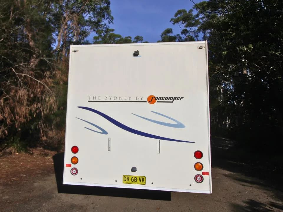 2011 Suncamper Sydney motorhome — rear exterior panel with The Sydney by Suncamper badge