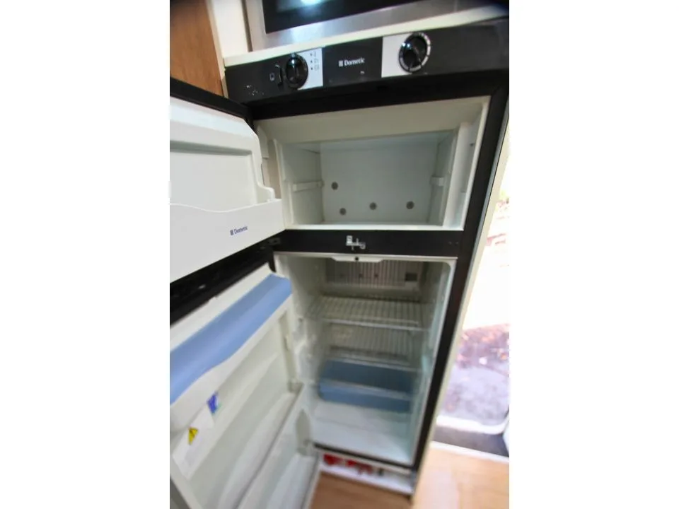 2011 Suncamper Sydney motorhome — interior Dometic fridge and freezer open