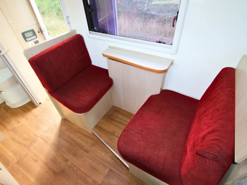 2015 Suncamper Sherwood 4x4 Twin motorhome — interior dinette bench seating detail