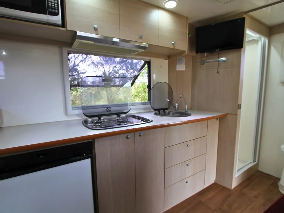 2015 Suncamper Sherwood 4x4 Twin motorhome — interior kitchen with stainless sink