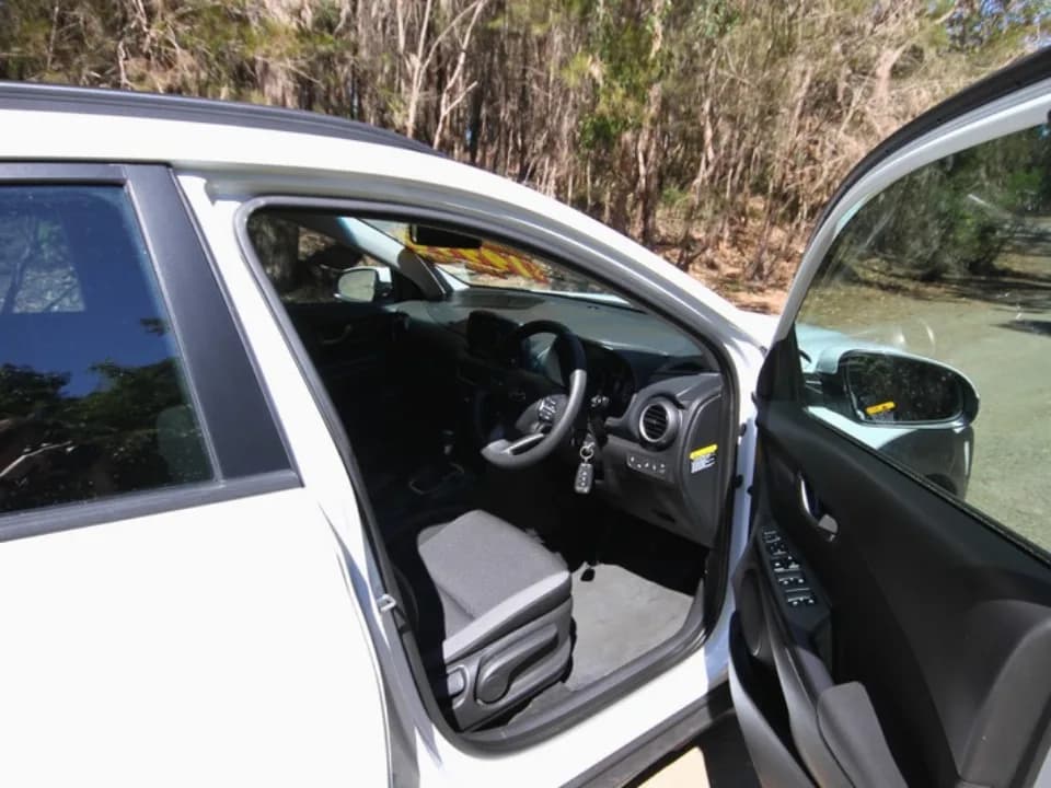 2019 Hyundai Kona Go — driver's door open showing front seat and dashboard