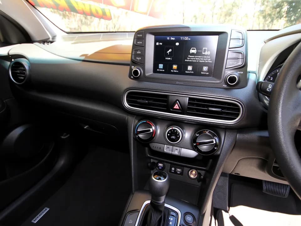 2019 Hyundai Kona Go interior — touchscreen infotainment with Apple CarPlay and Android Auto, climate controls