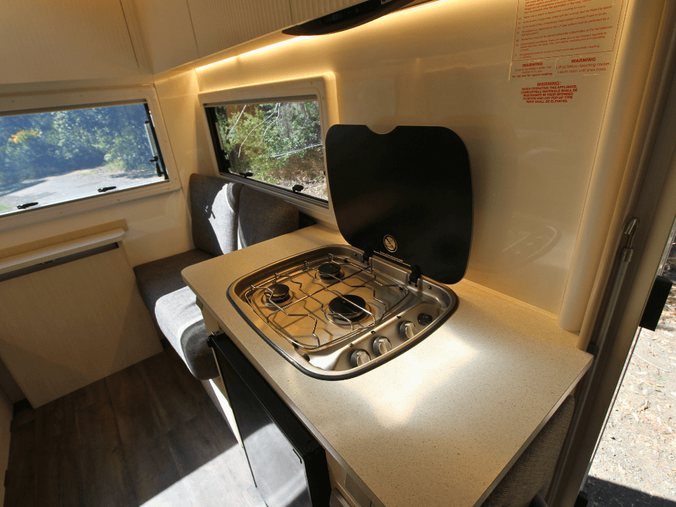 2024 Suncamper Sherwood E-2 interior — kitchen with gas cooktop