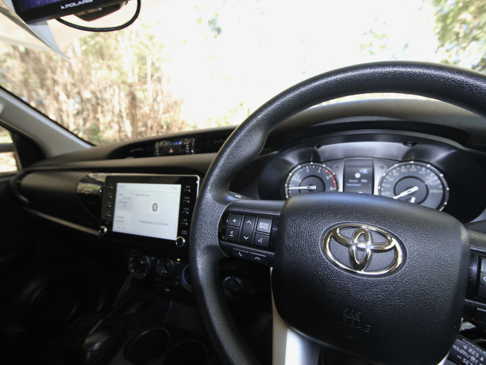 2024 Suncamper Sherwood E-2 interior — Toyota HiLux cab with touchscreen infotainment