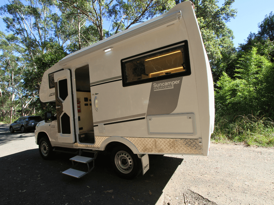 2024 Suncamper Sherwood E-2 exterior — passenger side with entry door and steps